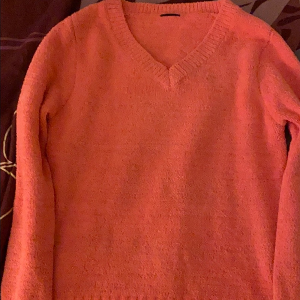 A pink sweater